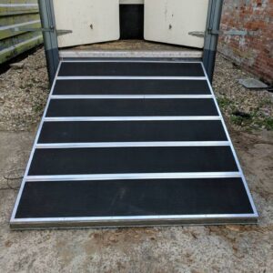 Black Griptop installed onto a Ramp with 5 x ally top hat strip across the front with 4 x ally angle around the outside