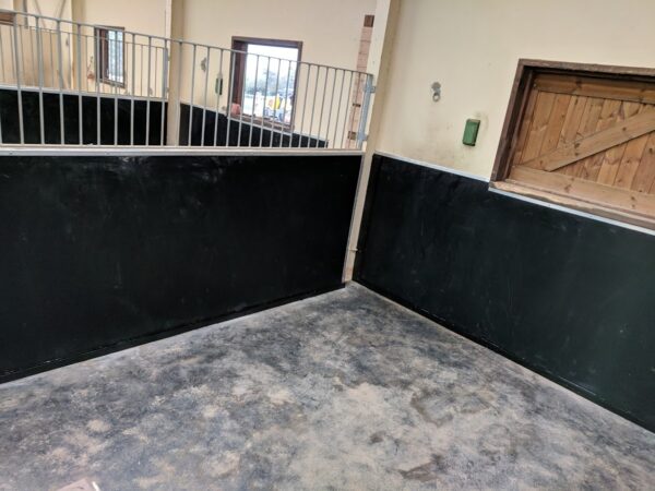 6mm rubber insertion installed onto the stable wall. Anti-chew capping has been added to stop the horse chewing the edge.