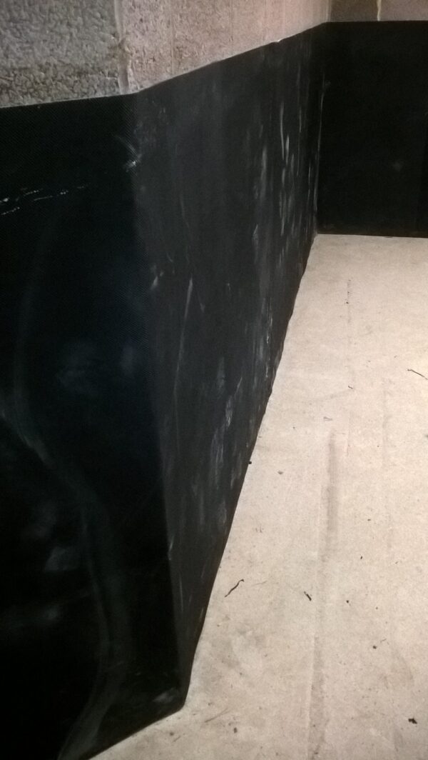 10mm EVA wall mats installed around a corner on a breese block wall using the our Stable Spray