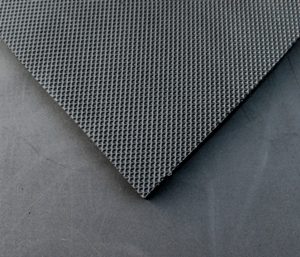 a close up veiw of a 2omm EVA showing the diamonf patteren of the topside and the smooth back side of the mat