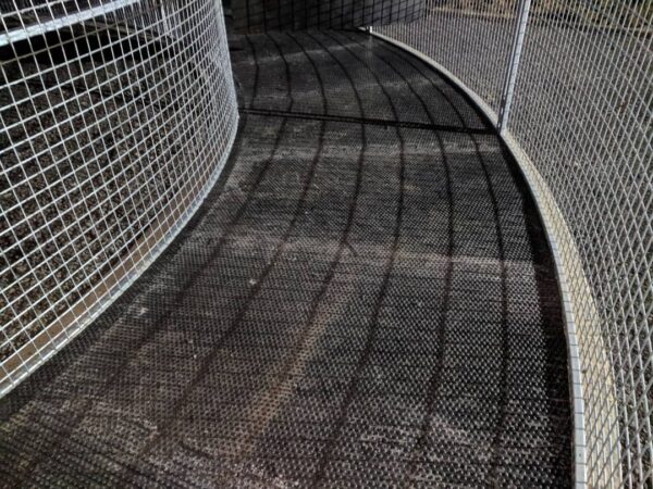 Pre-cut 35ft Horse walker matting, with a 5ft walkway. Laid into a wire cage horse walker.