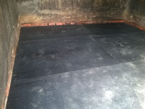 easy sweep stable mats installed into a stable