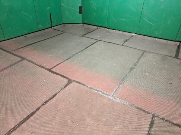 a vetrinery nock down room with fully sealed 17mm cobbletop matting installed.