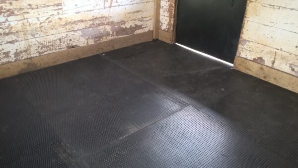 Anti-slip bubbletop topped stable mats intstalled into a stable