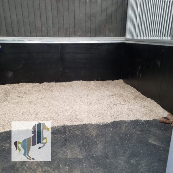 deluxe wall panels install into American barn style stable.