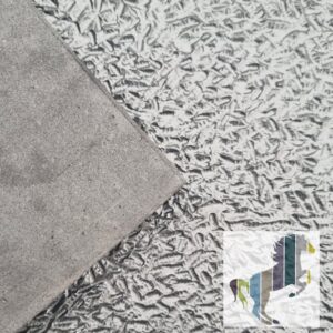 The Newbury mat showing a small peice of the smooth underside and the patterned top side